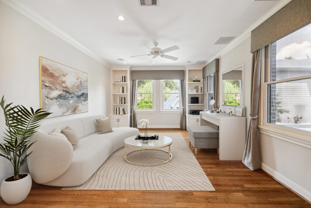 Bright sitting room with white sofa and built-in desk