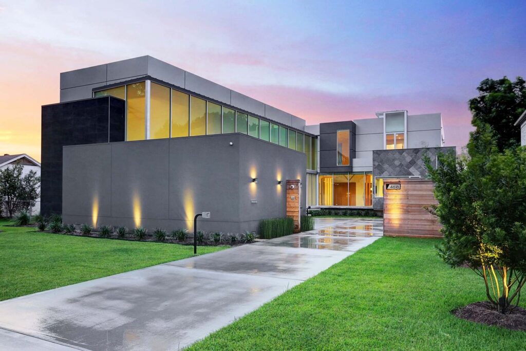 Modern home exterior with long driveway