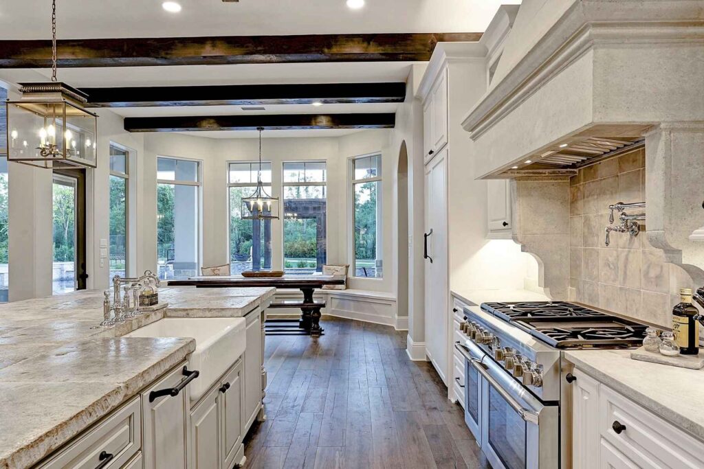 Bright white kitchen with island and range