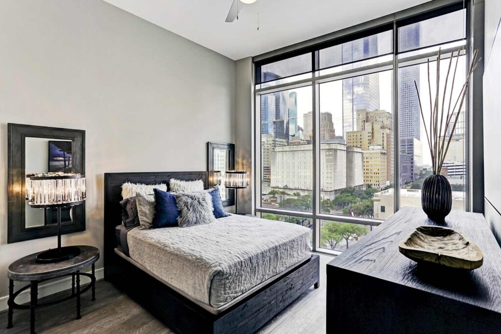 Modern bedroom with city skyline view