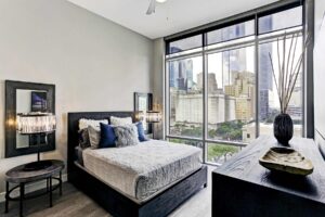 Modern bedroom with city skyline view