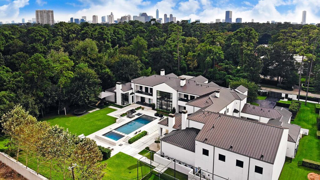 Aerial view of luxury estate with pool