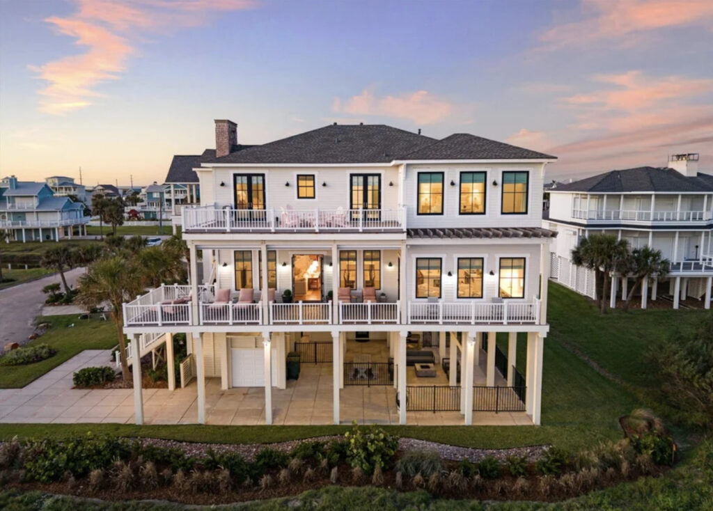 Luxury coastal home photographed at sunset