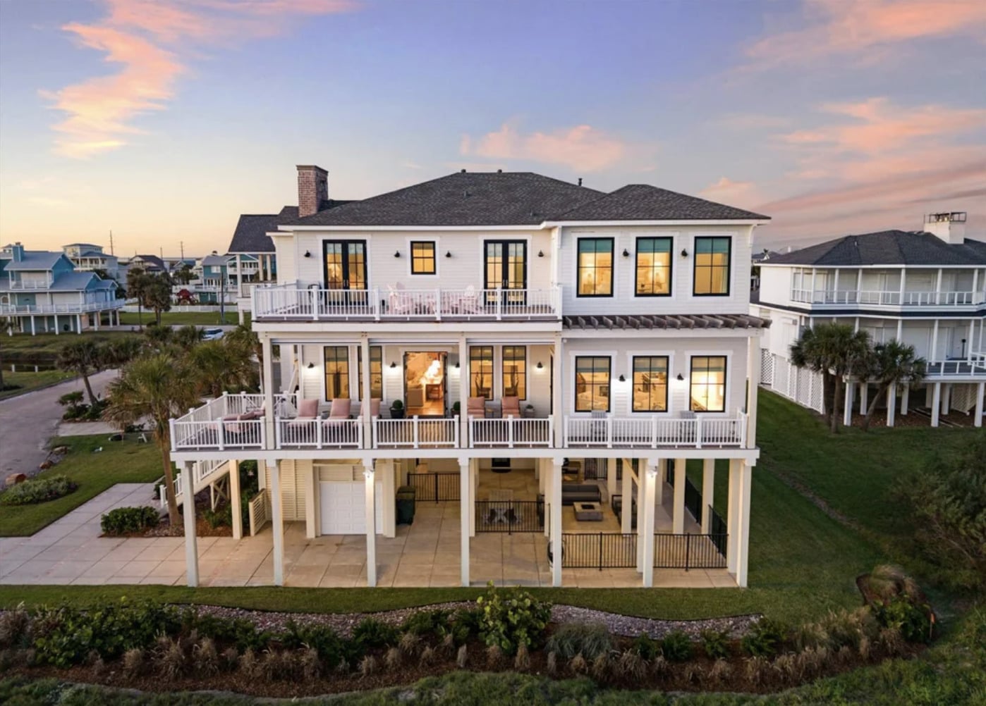 Luxury coastal home photographed at sunset